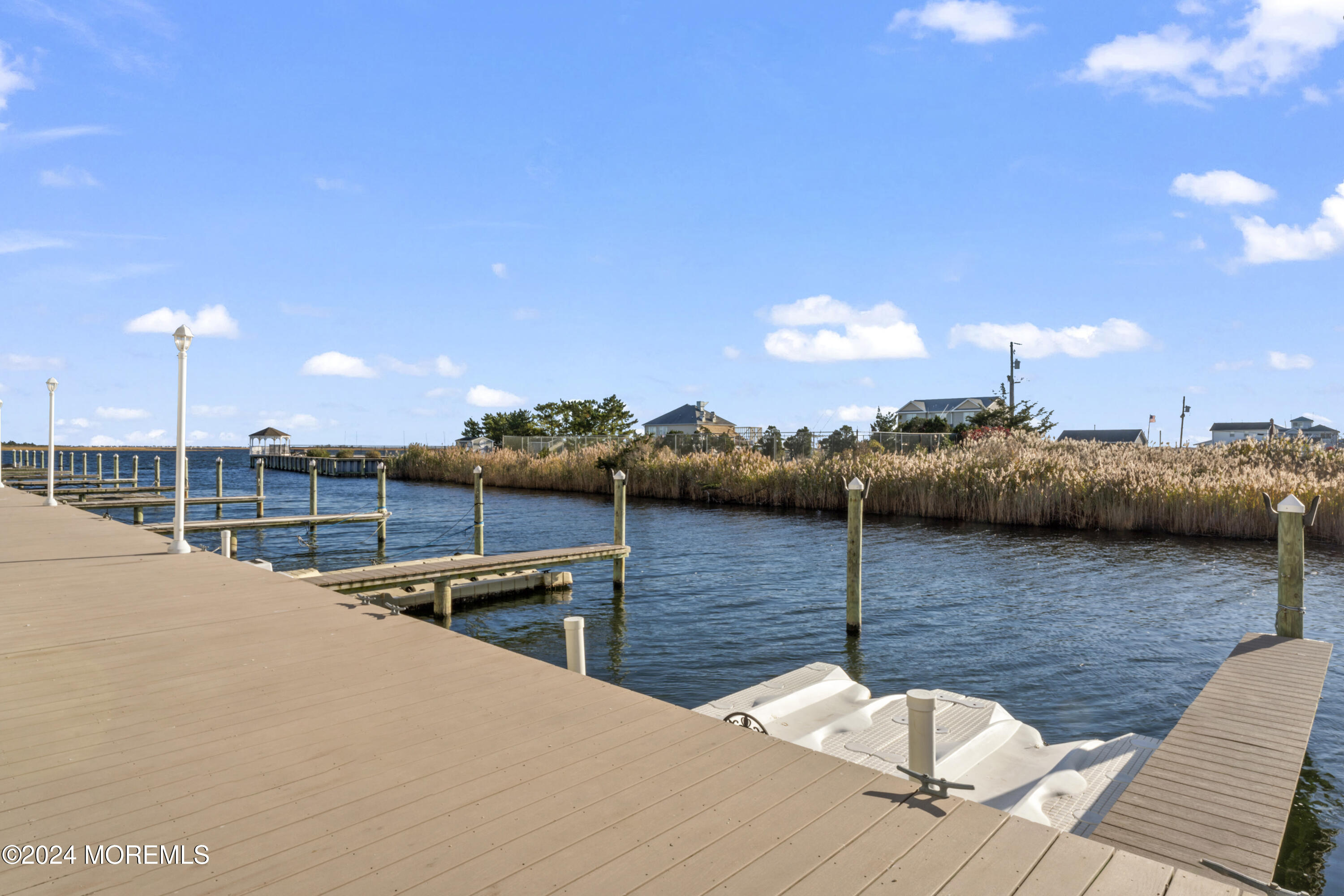 441 East Bay Avenue, Unit 10 Barnegat, NJ 08005 - Photo 36 of 53 a view of a terrace with chairs