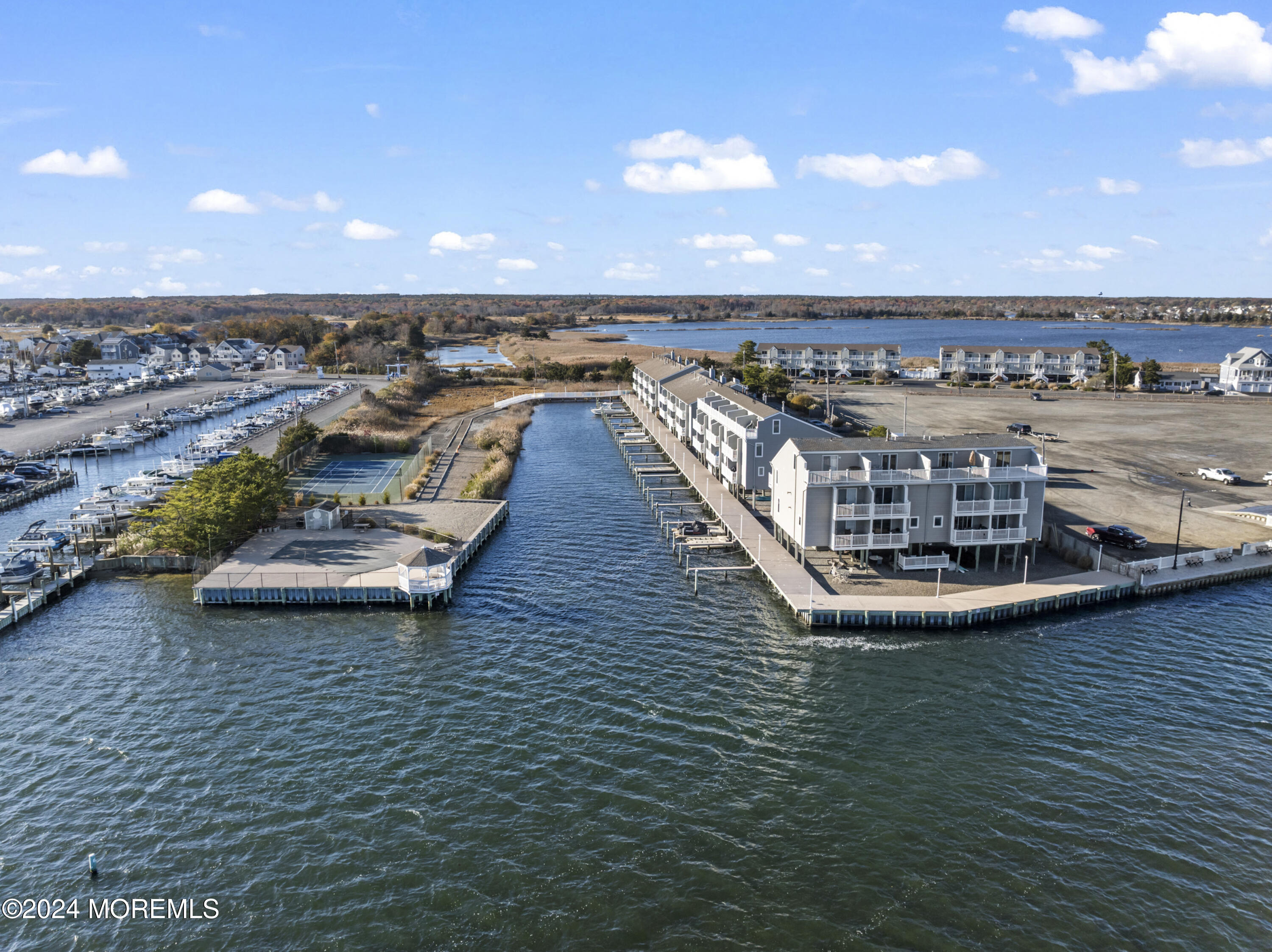 441 East Bay Avenue, Unit 10 Barnegat, NJ 08005 - Photo 43 of 53 a view of a swimming pool with lounge chair