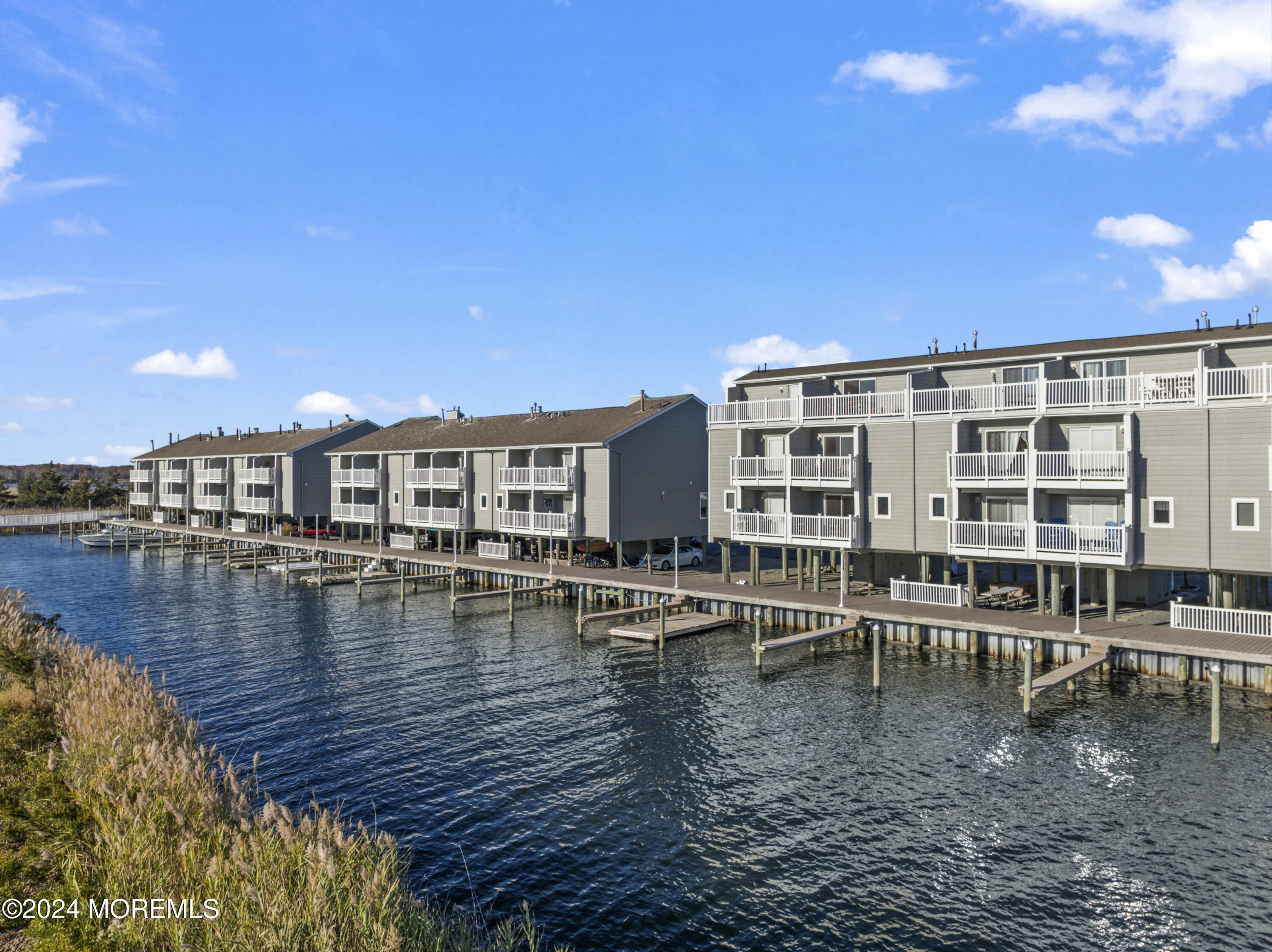 441 East Bay Avenue, Unit 10 Barnegat, NJ 08005 - Photo 46 of 53 a view of a swimming pool with outdoor seating