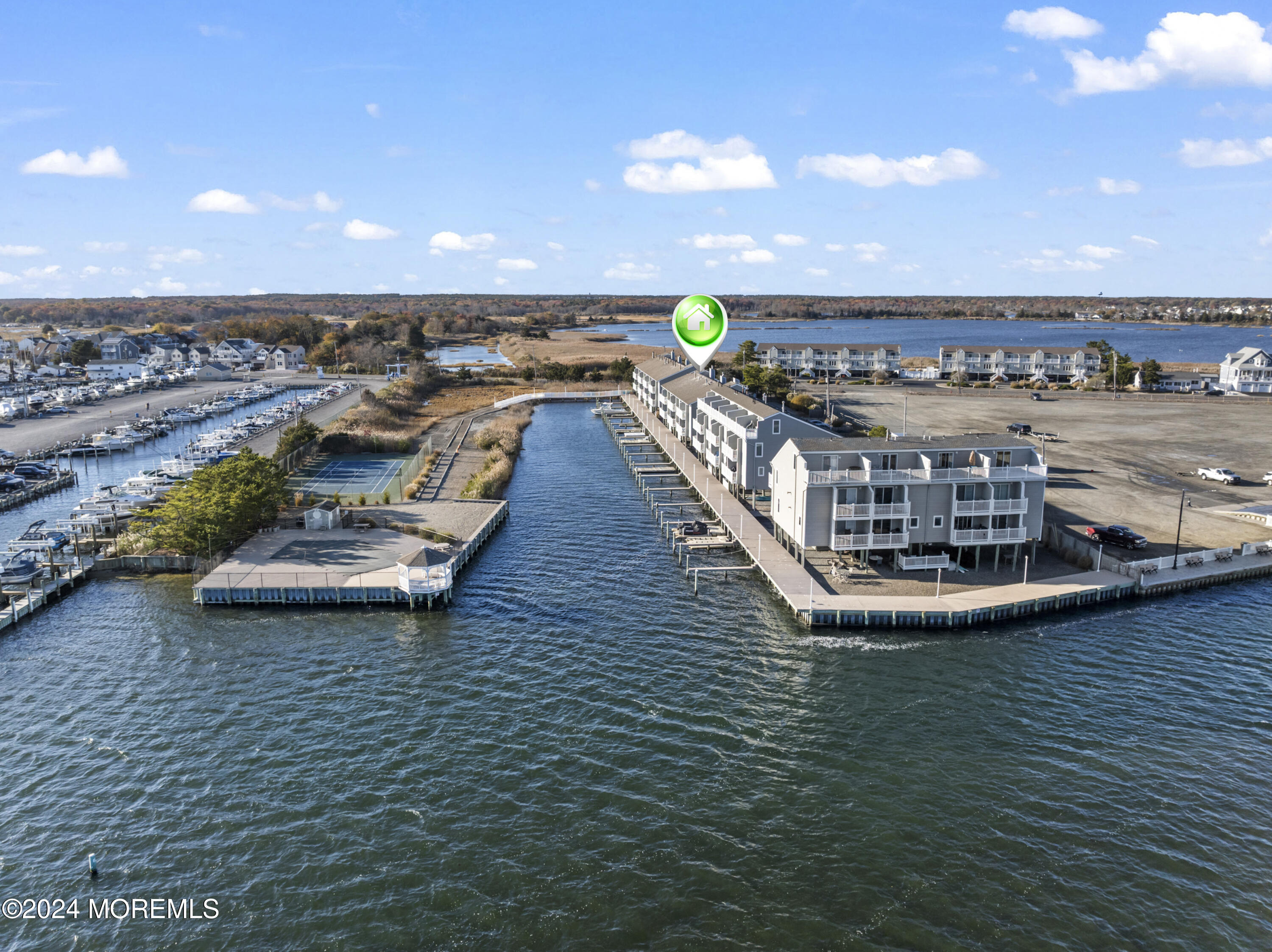 441 East Bay Avenue, Unit 10 Barnegat, NJ 08005 - Photo 7 of 53 a view of a swimming pool with lawn chairs