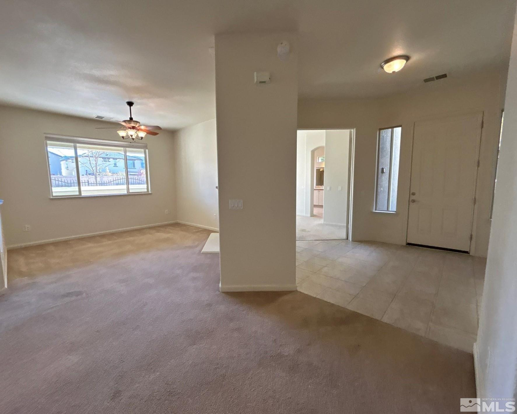 9900 Wilbur May Parkway, Unit 3402 Reno, NV 89521 - Photo 2 of 26 an empty room with windows and closet