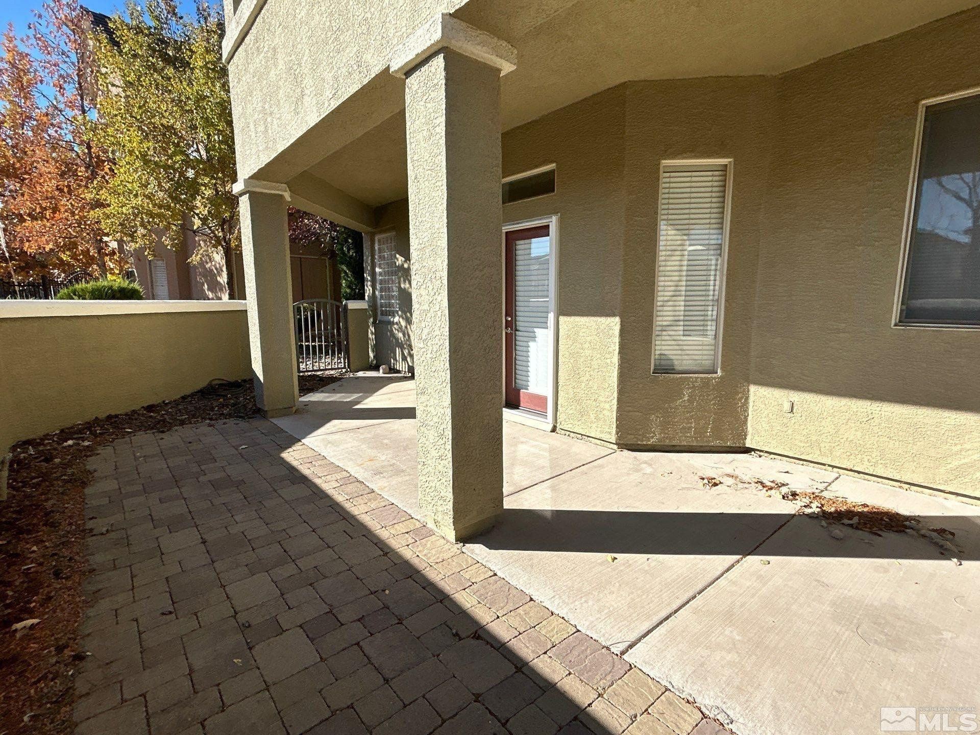 9900 Wilbur May Parkway, Unit 3402 Reno, NV 89521 - Photo 22 of 26 a view of a building with a bench