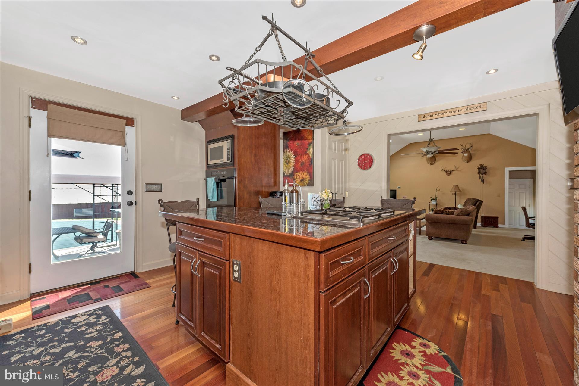 1210 Florence Road Mount Airy, MD 21771 - Photo 6 of 30 a kitchen with stainless steel appliances granite countertop a stove and a wooden floors