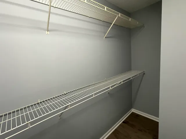 a view of a room with racks on the wall