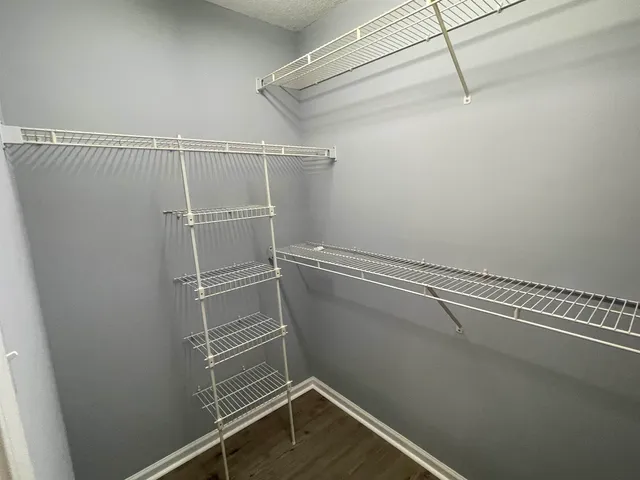 a view of a room with racks on the wall