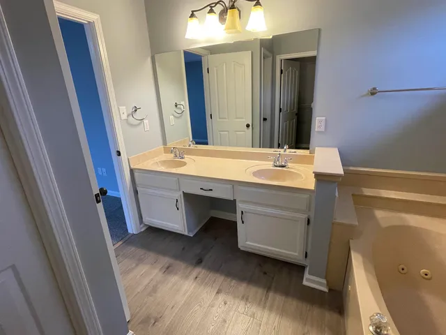 a bathroom with a bathtub and a shower