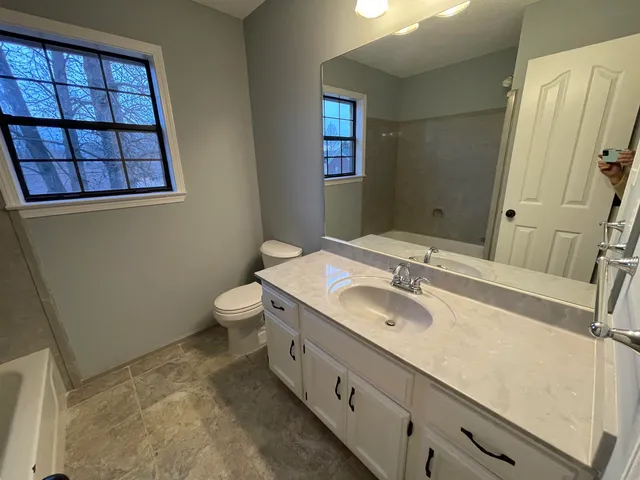 a bathroom with a sink and a tub