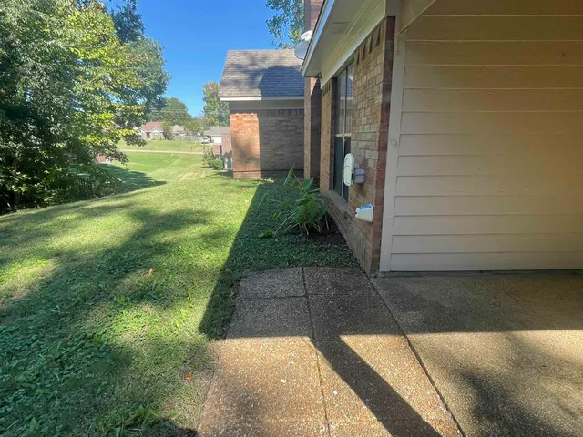a view of yard from a corridor