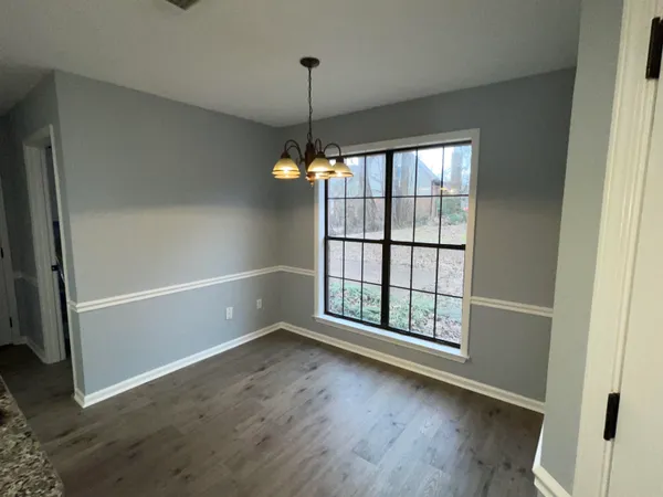 a kitchen with a sink a counter top space and cabinets