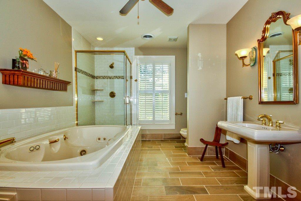 5504 Graham Daniel Road Rougemont, NC 27572 - Photo 15 of 25 a bathroom with a bathtub and a sink