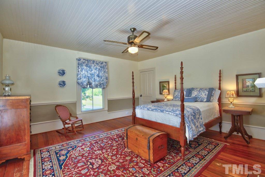5504 Graham Daniel Road Rougemont, NC 27572 - Photo 18 of 25 a bedroom with a bed and wooden floor