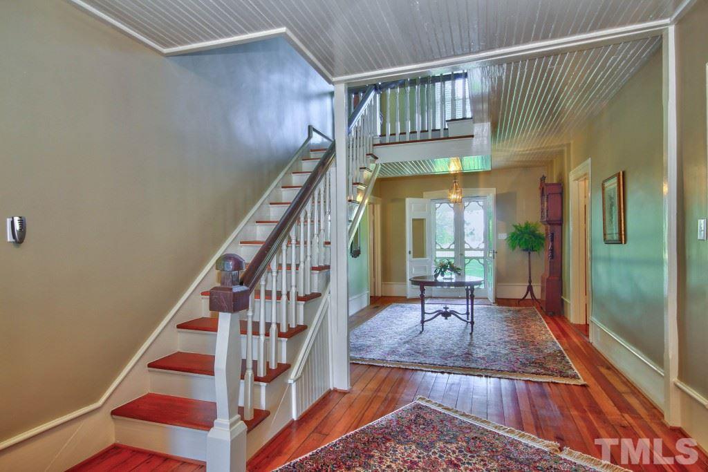 5504 Graham Daniel Road Rougemont, NC 27572 - Photo 3 of 25 a view of staircase with large window and wooden floor