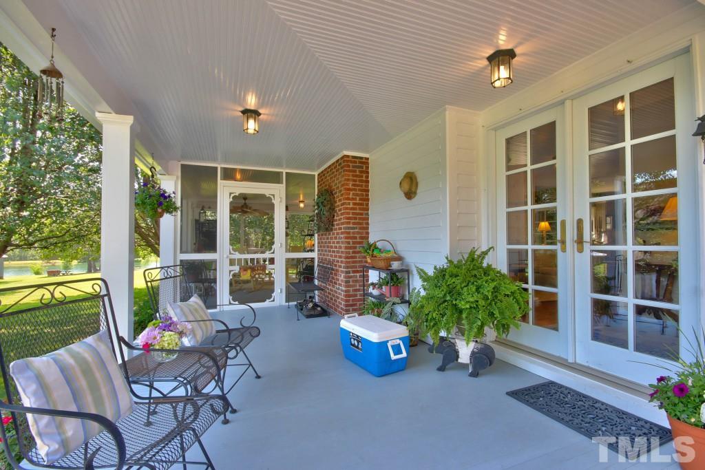 5504 Graham Daniel Road Rougemont, NC 27572 - Photo 21 of 25 a living room filled with furniture and a potted plant
