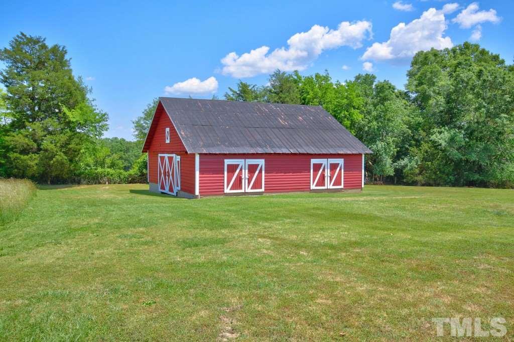 5504 Graham Daniel Road Rougemont, NC 27572 - Photo 23 of 25 a view of a house with a yard
