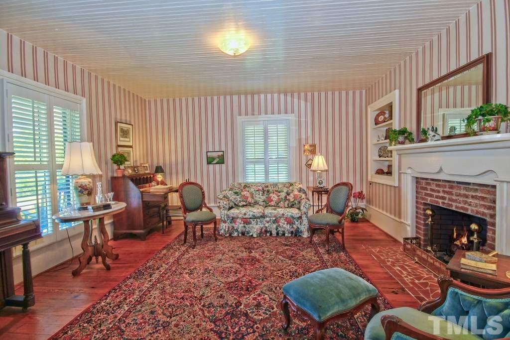 5504 Graham Daniel Road Rougemont, NC 27572 - Photo 4 of 25 a living room with furniture fireplace and window