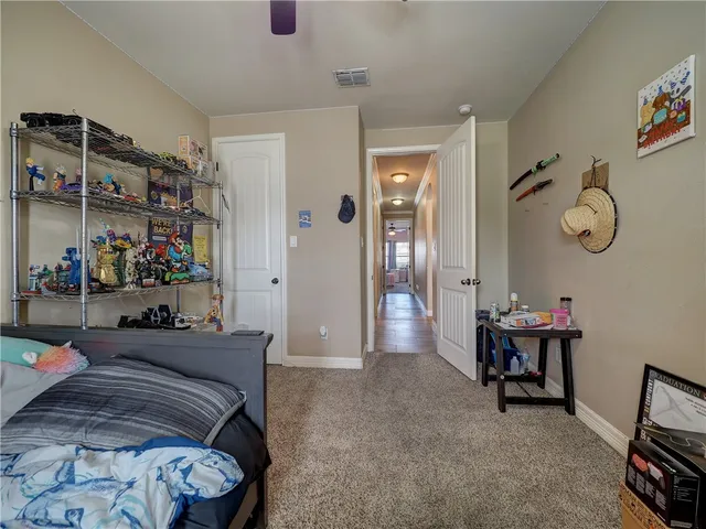 a bedroom with furniture and a chandelier