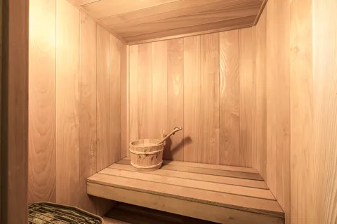 a view of a room with a bed and curtain