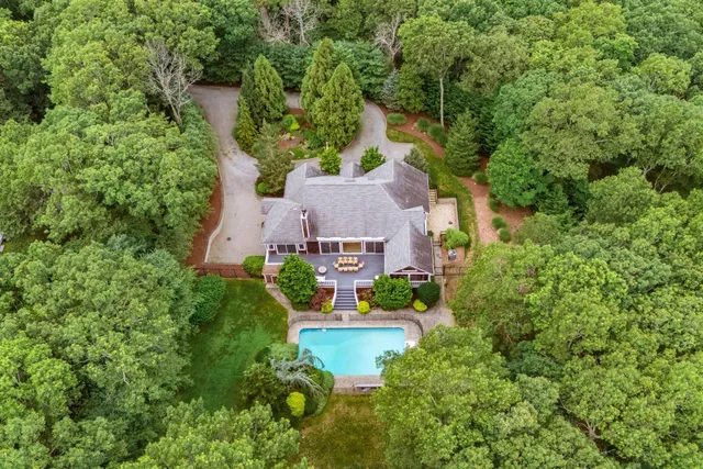 an aerial view of a house with a garden