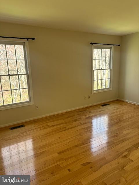 23 Bogey Circle Doylestown, PA 18901 - Photo 14 of 32 a view of an empty room with wooden floor and a window