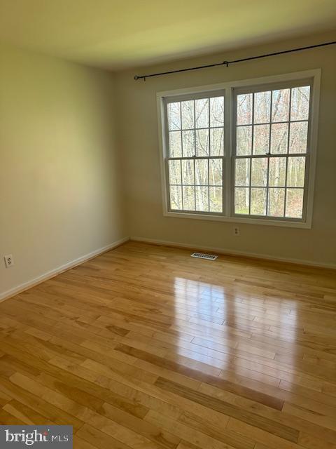 23 Bogey Circle Doylestown, PA 18901 - Photo 21 of 32 a view of an empty room with wooden floor and a window