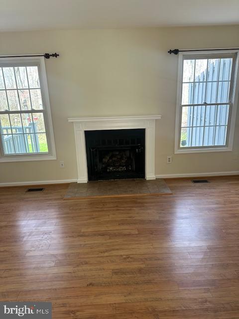 23 Bogey Circle Doylestown, PA 18901 - Photo 6 of 32 an empty room with wooden floor fireplace and windows