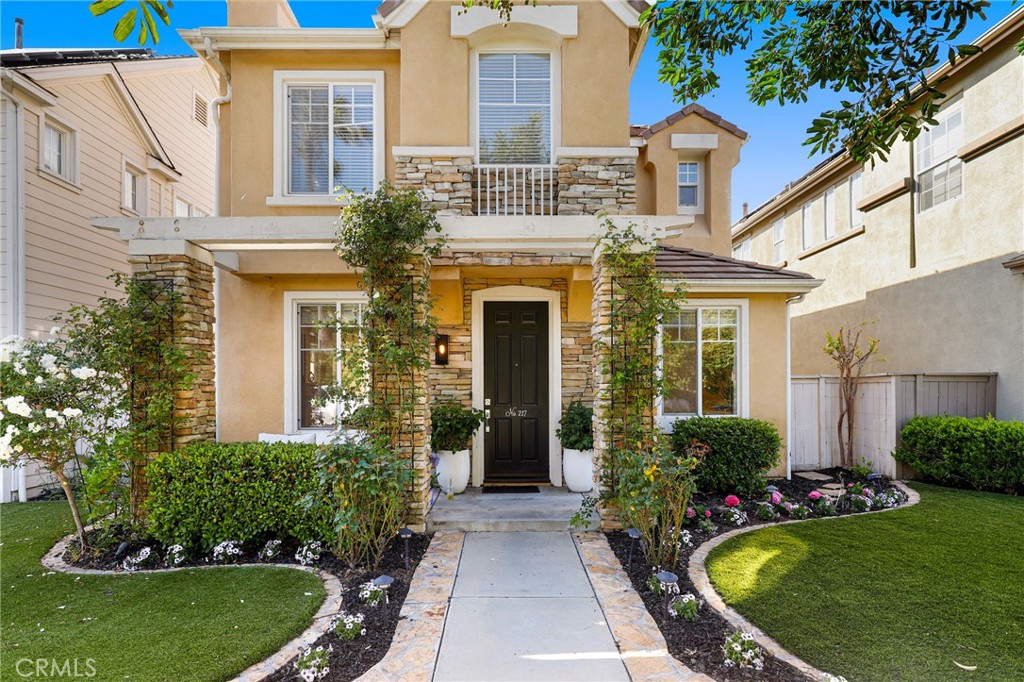 front view of a house with a yard