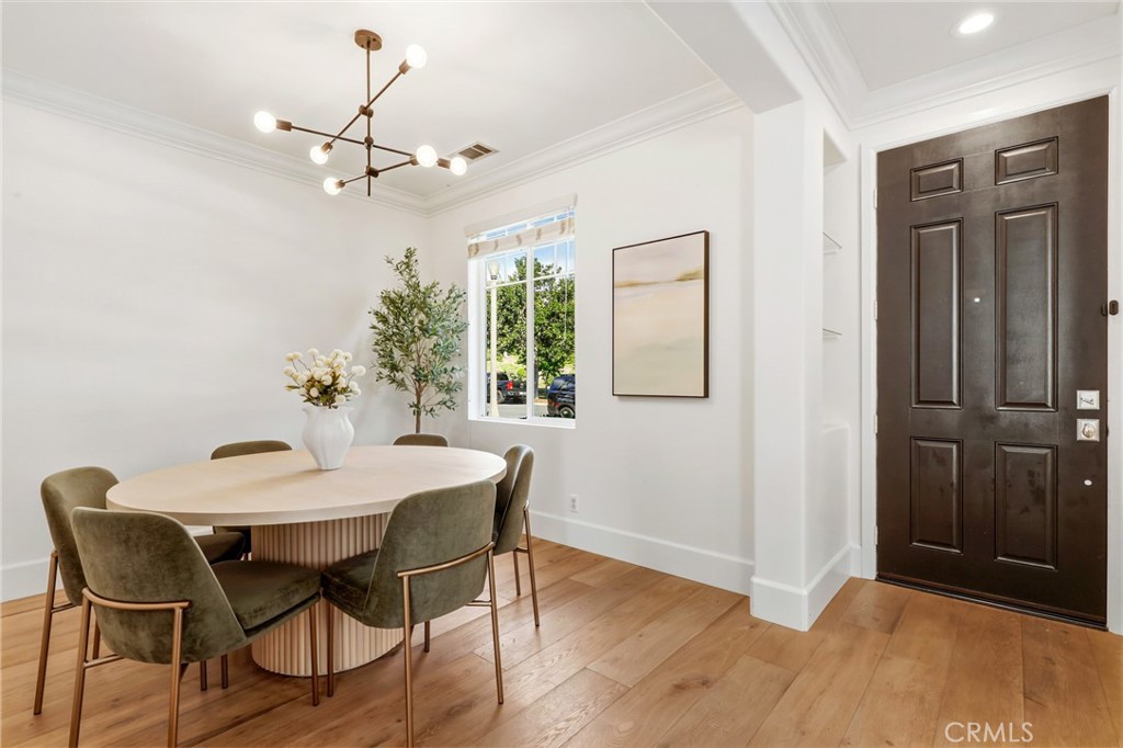 217 Sklar Street Ladera Ranch, CA 92694 - Photo 14 of 59 a view of a dining room with furniture and wooden floor