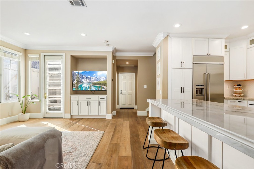 217 Sklar Street Ladera Ranch, CA 92694 - Photo 16 of 59 a living room with stainless steel appliances furniture and a kitchen view