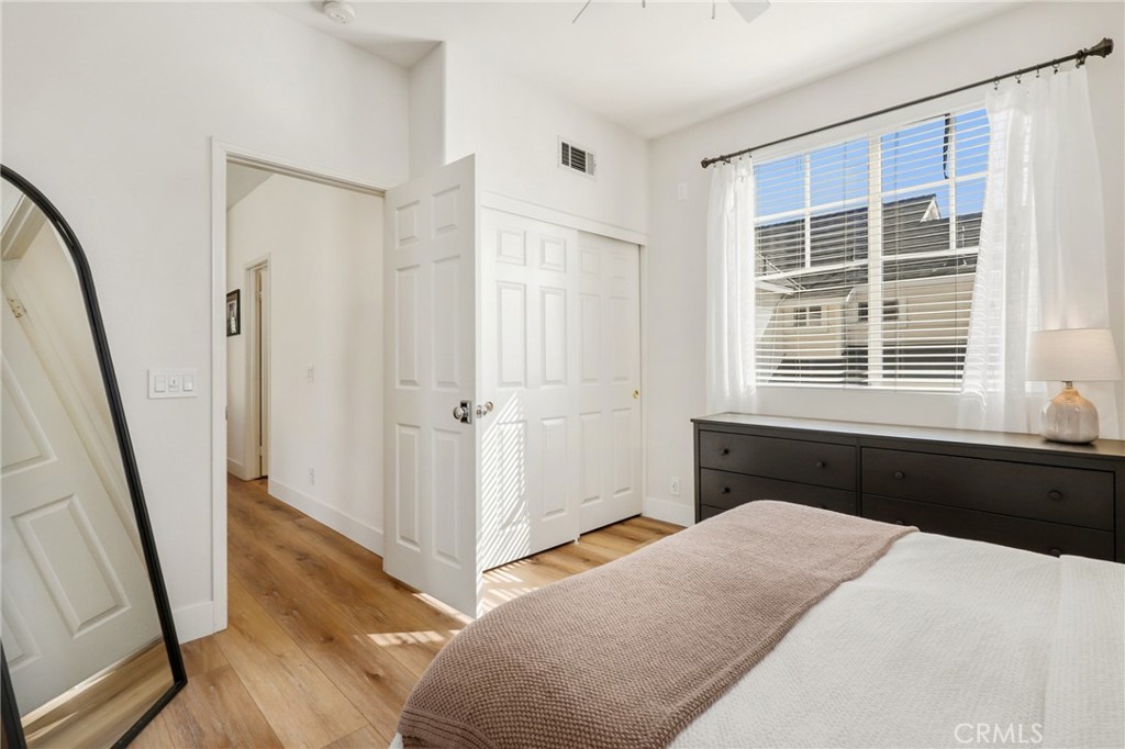 217 Sklar Street Ladera Ranch, CA 92694 - Photo 22 of 59 a bedroom with a bed closet and a window