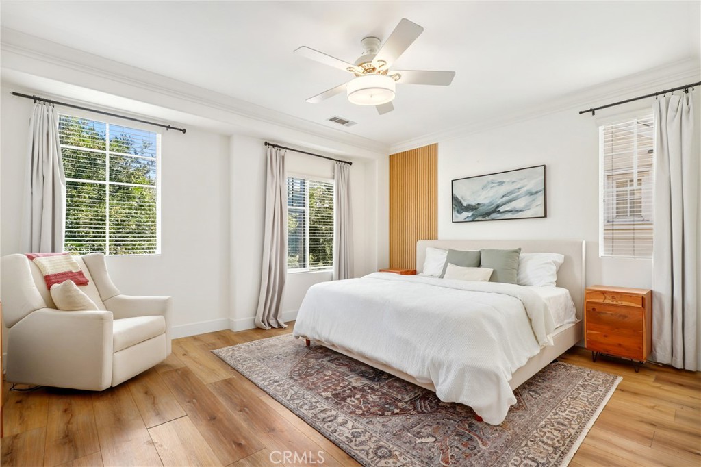 217 Sklar Street Ladera Ranch, CA 92694 - Photo 26 of 59 a bedroom with a large bed couch and a window