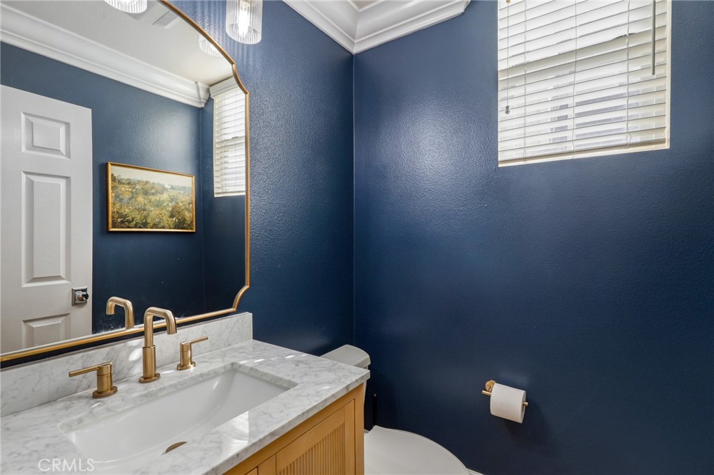 217 Sklar Street Ladera Ranch, CA 92694 - Photo 30 of 59 a bathroom with a sink vanity mirror and toilet