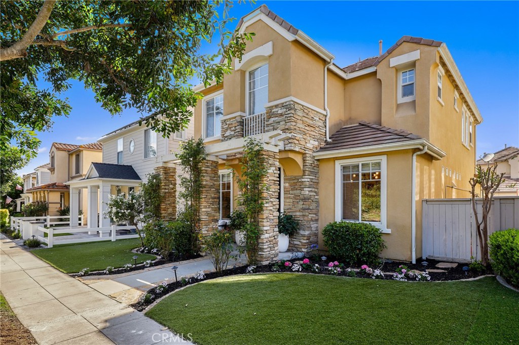 217 Sklar Street Ladera Ranch, CA 92694 - Photo 3 of 59 a front view of a house with a garden and plants
