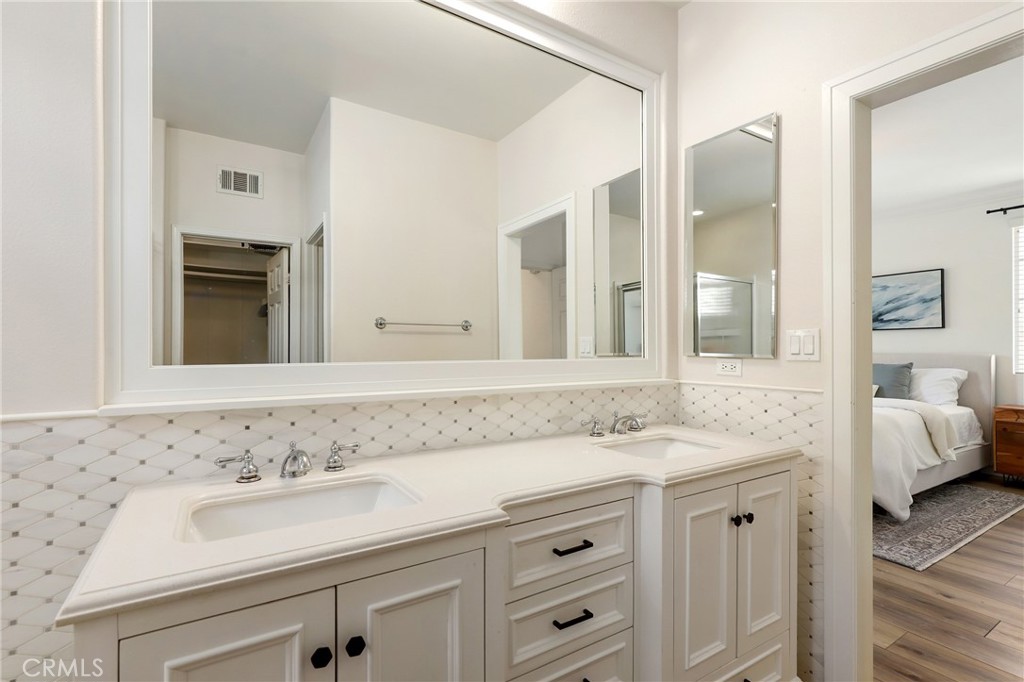 217 Sklar Street Ladera Ranch, CA 92694 - Photo 32 of 59 a bathroom with a sink and a mirror