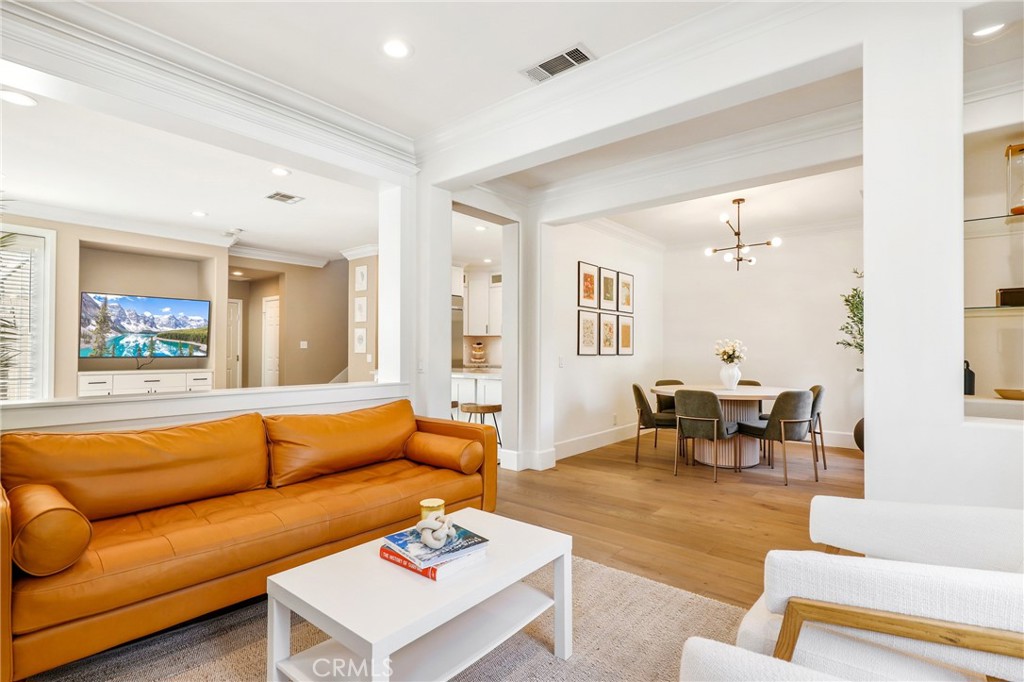 217 Sklar Street Ladera Ranch, CA 92694 - Photo 9 of 59 a living room with furniture wooden floor and a table