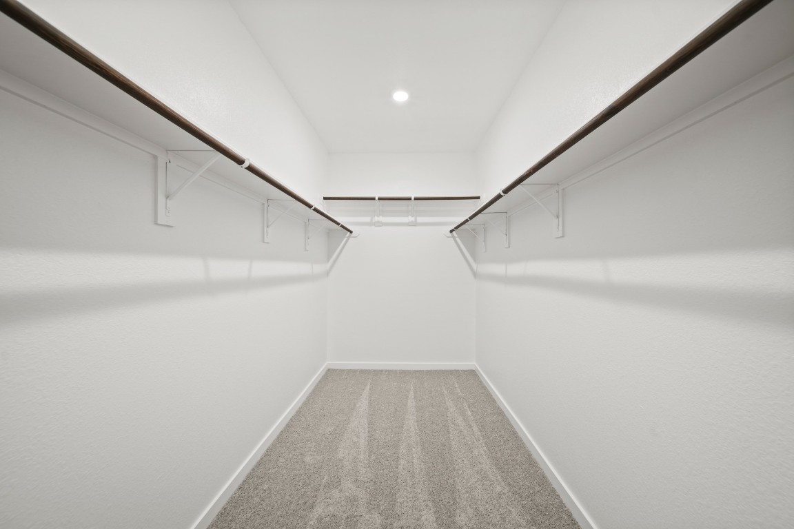 314 Amy Street Angleton, TX 77515 - Photo 19 of 31 a view of a room with racks on the wall