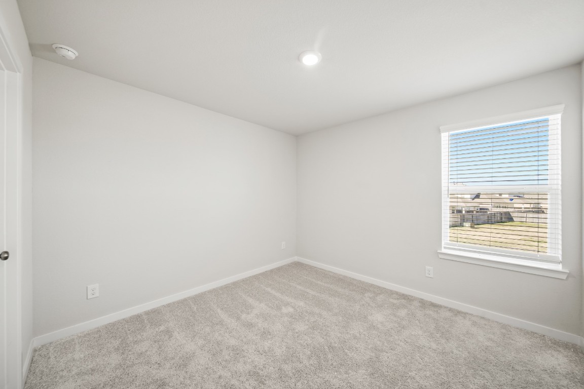 314 Amy Street Angleton, TX 77515 - Photo 22 of 31 an empty room with a window