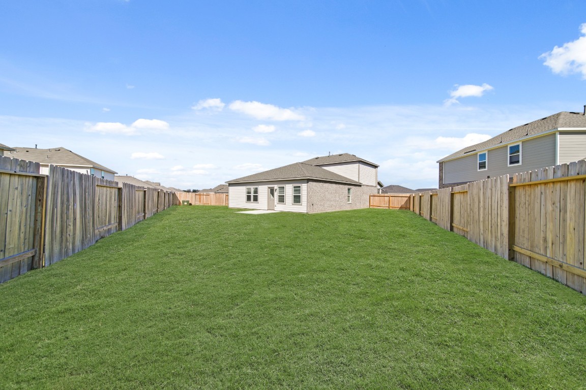 314 Amy Street Angleton, TX 77515 - Photo 6 of 31 a view of a house with backyard and garden