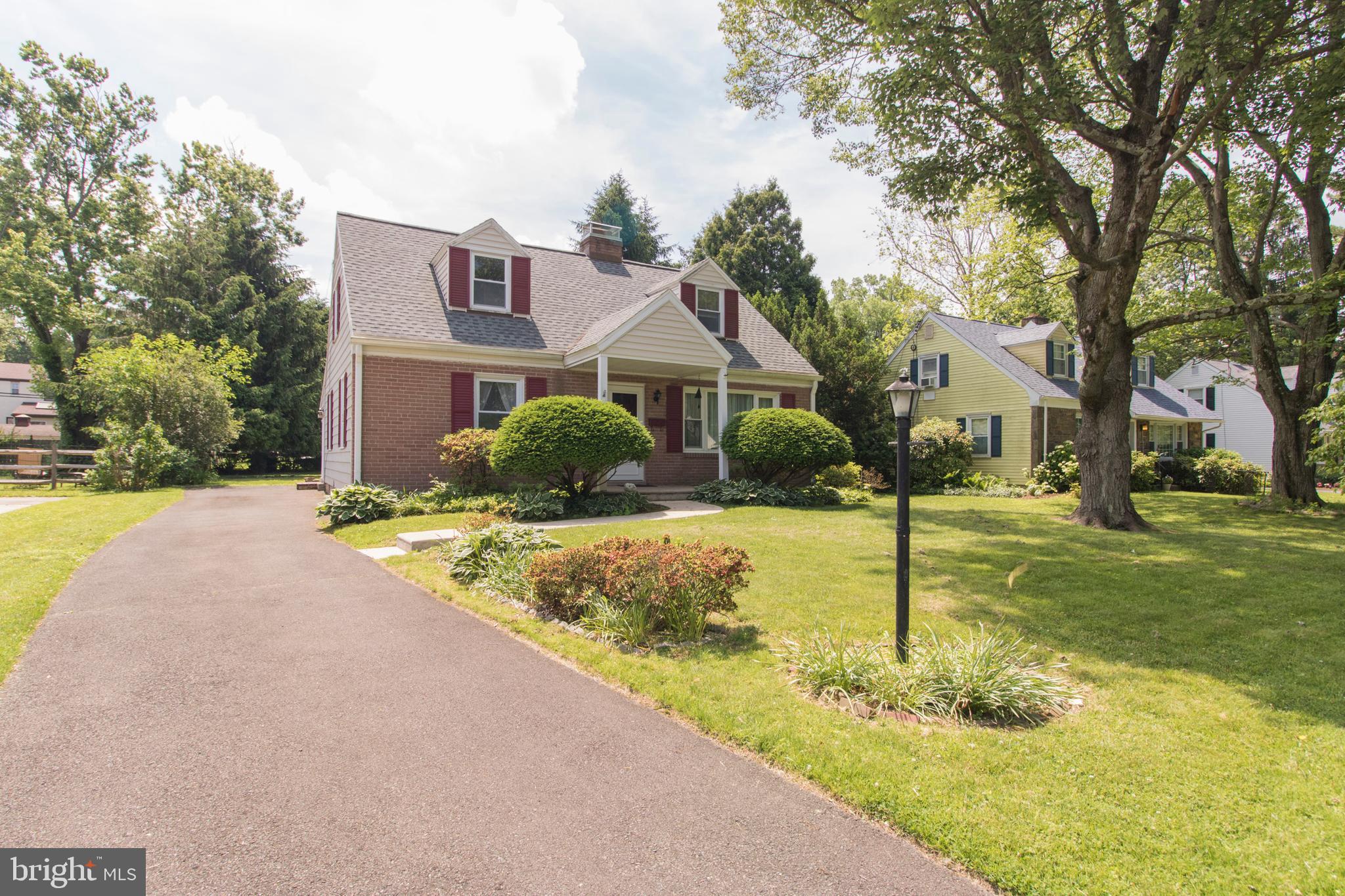 Exterior front with driveway for 4 cars