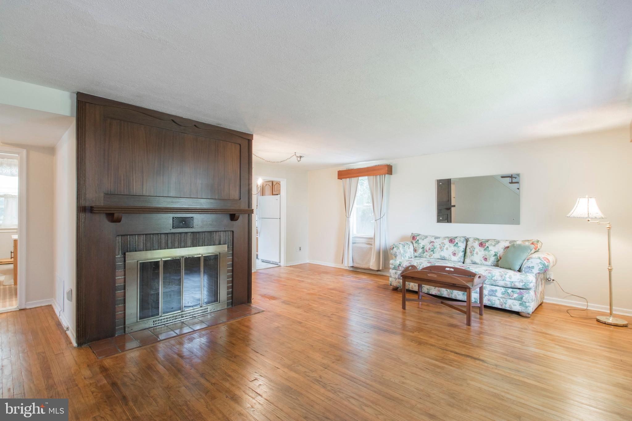 Living room with wood burning fireplace