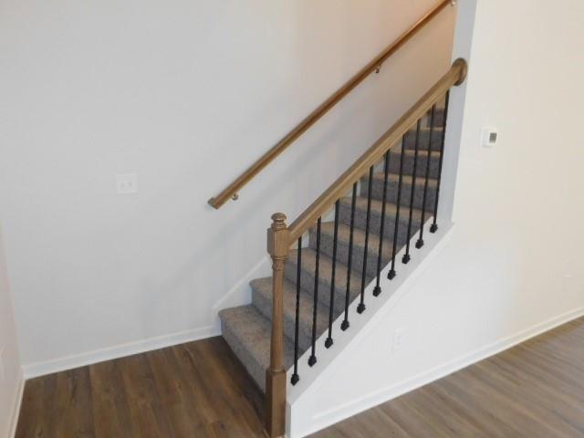 246 Dupont Drive Cartersville, GA 30121 - Photo 11 of 28 a view of staircase with wooden floor and white walls