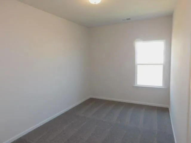 a view of a room with a hallway