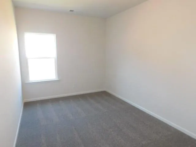 a white bath tub sitting next to a white toilet