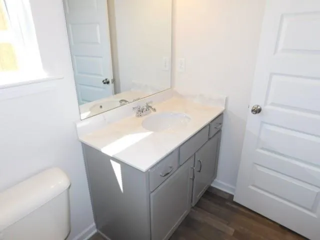 a view of house with backyard