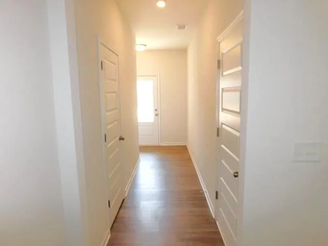 a view of a bathroom from the hallway