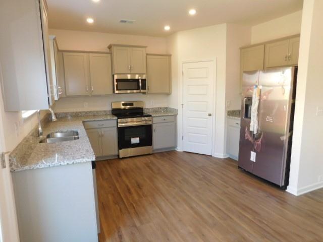 246 Dupont Drive Cartersville, GA 30121 - Photo 9 of 28 a kitchen with stainless steel appliances granite countertop a refrigerator a stove and a sink