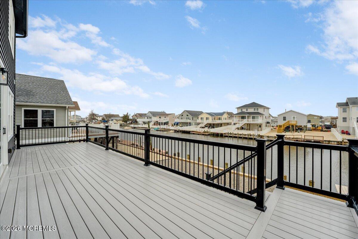 16 West Raritan Drive Little Egg Harbor, NJ 08087 - Photo 16 of 53 a view of a balcony with wooden floor and city view