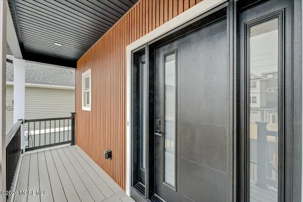 a view of entryway with wooden floor