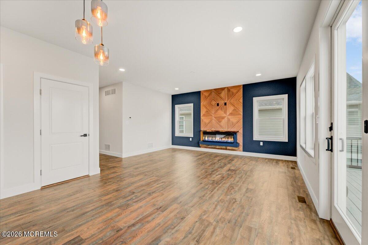 16 West Raritan Drive Little Egg Harbor, NJ 08087 - Photo 22 of 53 a view of an empty room with wooden floor and a window