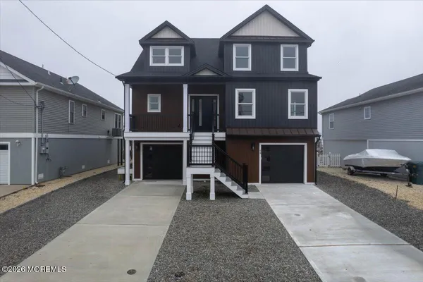 a front view of a house with a garage