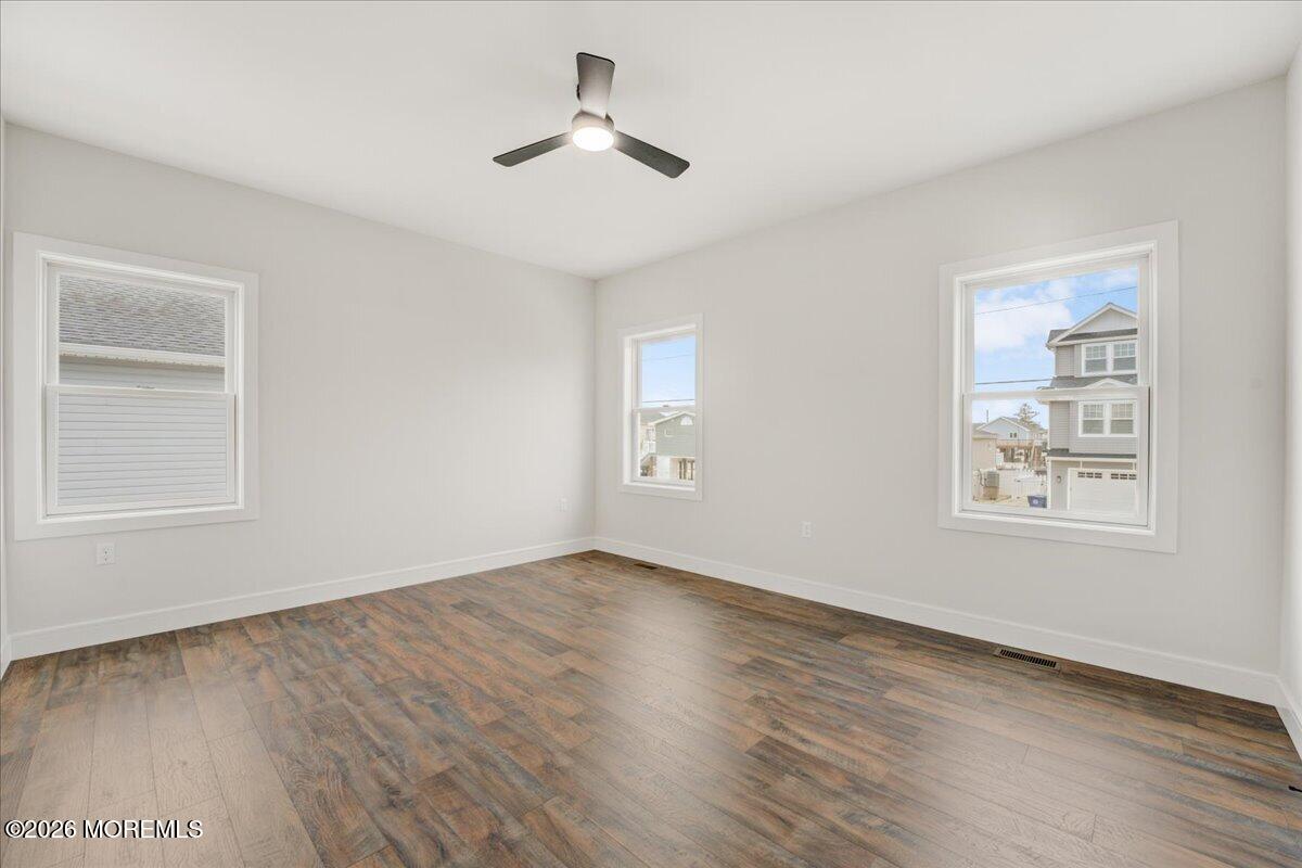 16 West Raritan Drive Little Egg Harbor, NJ 08087 - Photo 31 of 53 a view of empty room with wooden floor and fan
